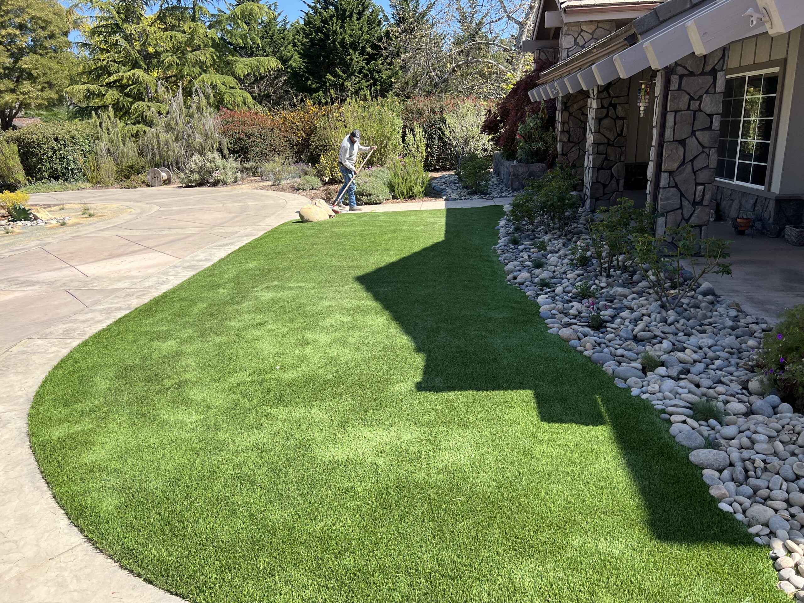 After - finished artificial turf and stone landscape