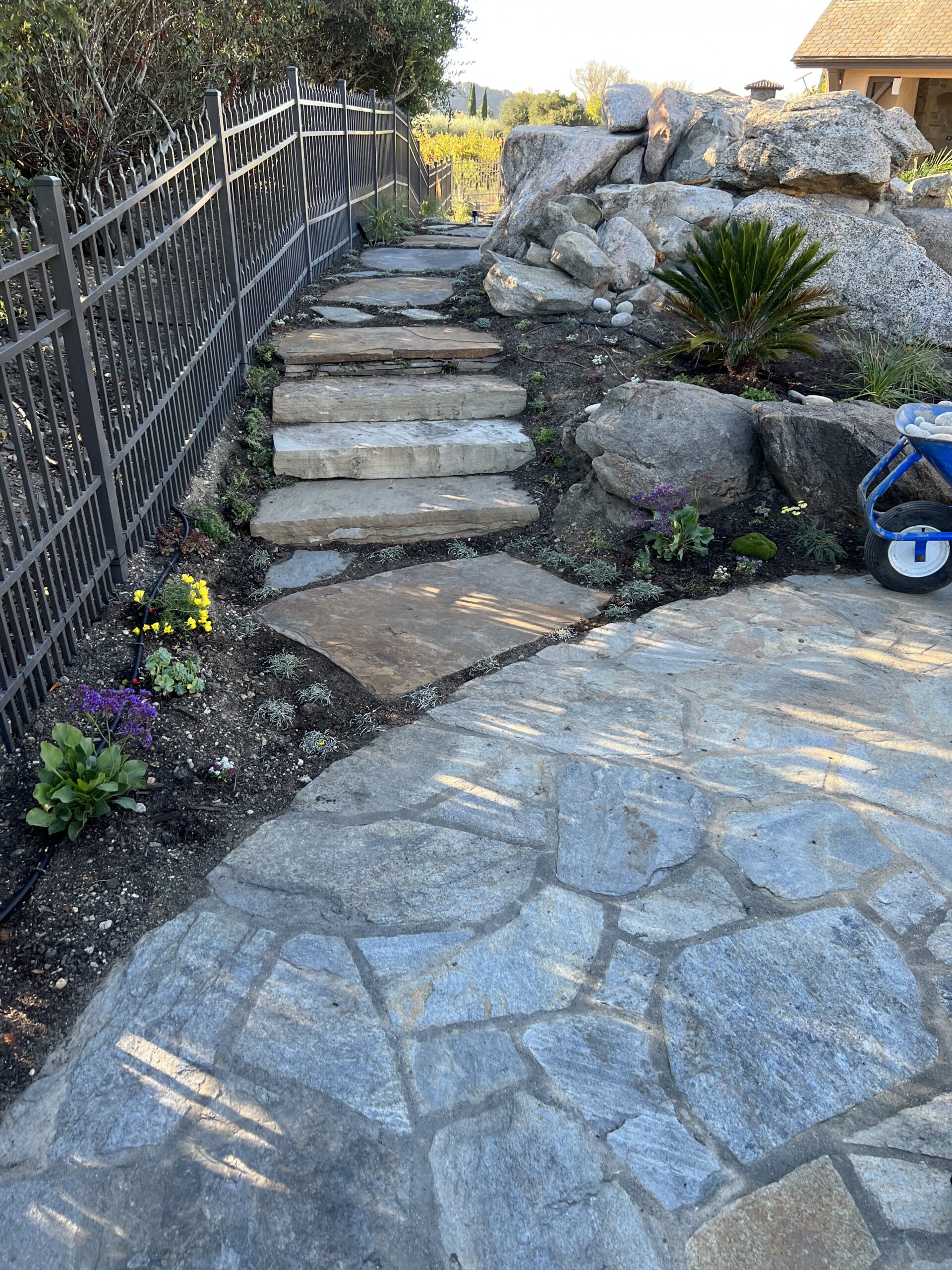 Flagstone veneer wall with rock garden