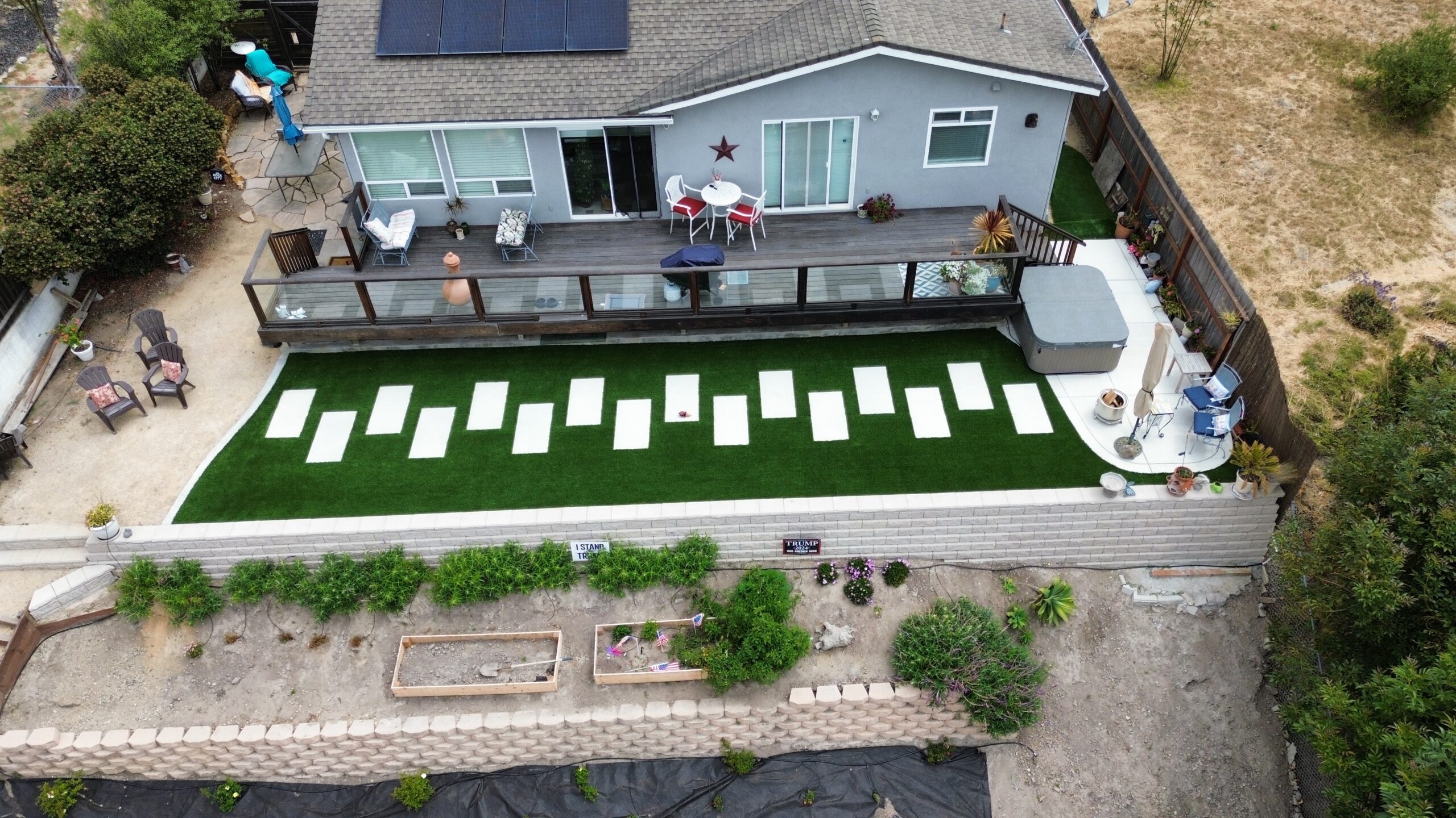 Aerial view of artificial turf and paver patio